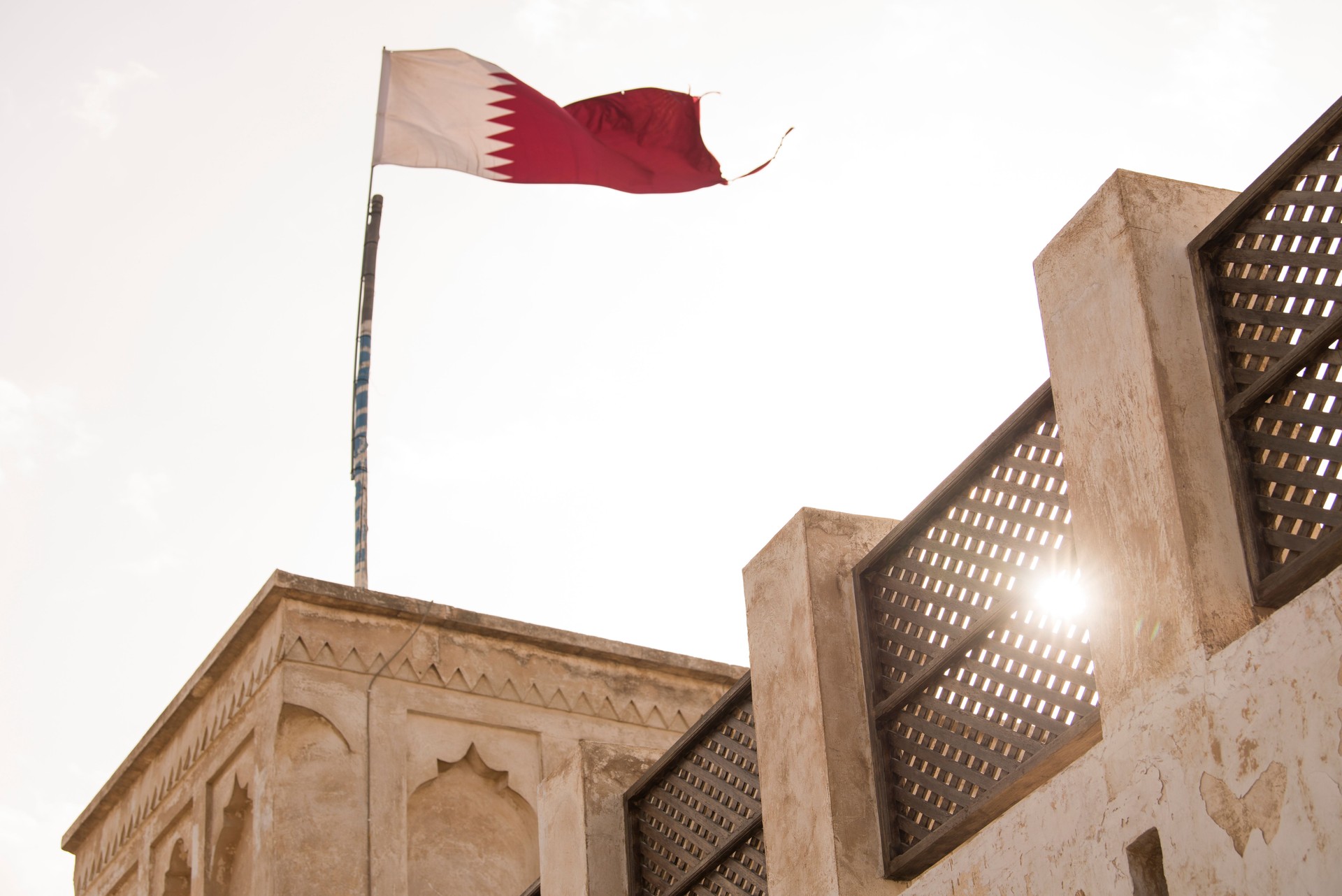 Traditional Arabian building with Qatar flag