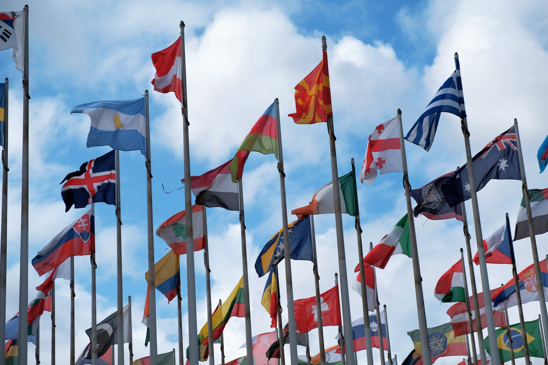 Flags from different countries around the world fluttering